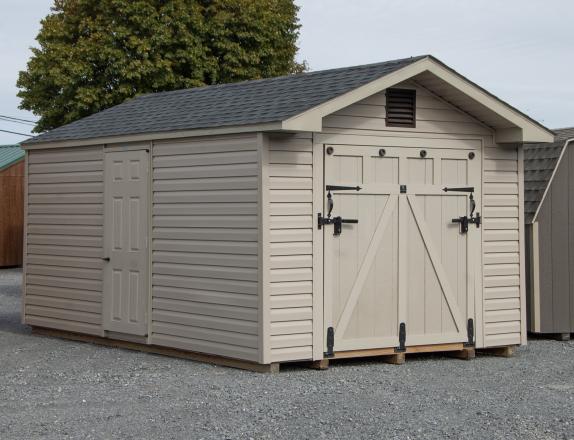 10x16 Peak Style Shed with Rampage Door And Pebble Clay Vinyl Siding