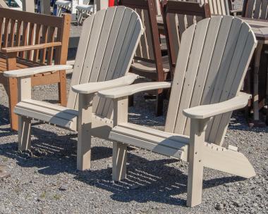 Two Woodgrain Poly Adirondack Chairs