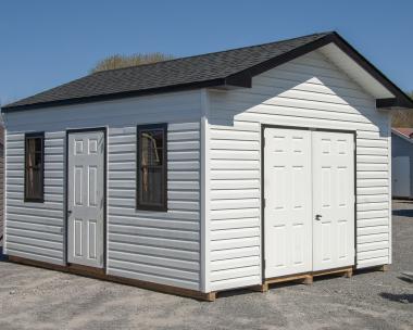 12x16 Front Entry Peak Storage Shed with White vinyl siding, black trim, extra doors