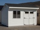 10x14 White Cottage style storage shed with shiplap siding for sale at Pine Creek Structures